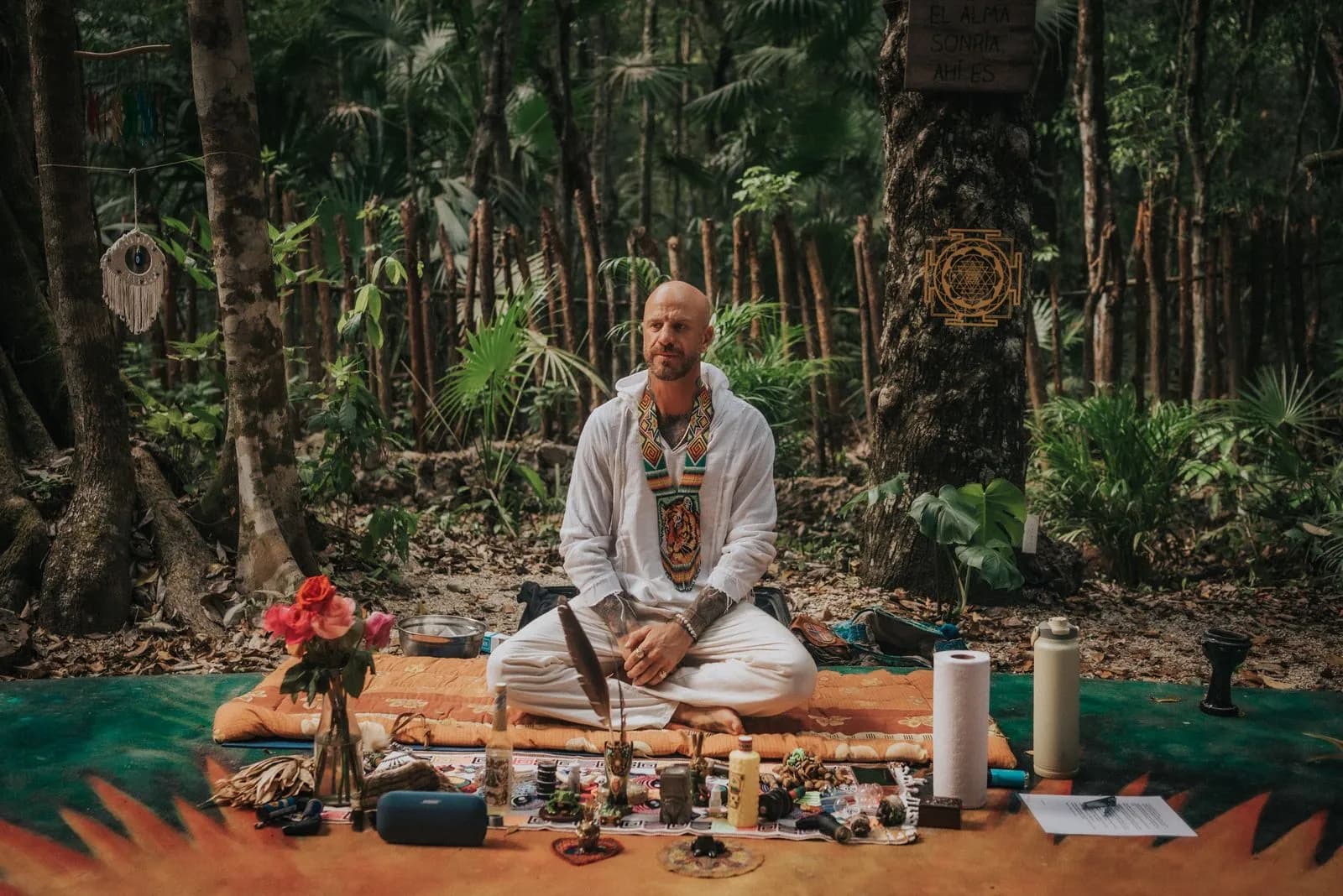 A retreat leader guiding a circle ceremony in the jungle at Lunita